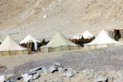 China - Tibet - Military camp outside Lhasa. Even though the country formally is an autonomous region in China, the province is de facto ruled from Beijing or through Chinese in Lhasa. The Chinese are trying to develop Tibet, but they are not very popular. These military troops worked on improving the road between the airport and the capital of Lhasa. It is a highly necessary improvement – the road was very bad.