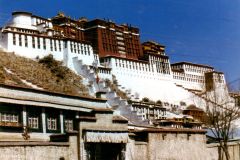 China - Tibet - Lhasa - Potala Palace, as it is known from postcards etc. It is a monumental building on top of a large hill in the middle of the city, in a large flat valley.