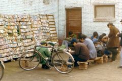 China - Xian - Streetside readers. This I believe was a public library of sorts. People would come here and read the books and magazines from the racks.