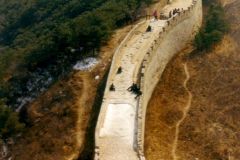 China - The Great Wall at Badaling. The section of the wall at Badaling was the first large section to be restored. It serves as the foremost spot to see and walk on the Wall. This popularity is also due to its proximity to the Ming graves and the short distance from Beijing. This picture shows that there remains considerable reconstruction work to be done even here.