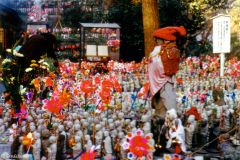 Japan - Kamakura - Bodhisattvas placed by worshippers in the garden of a Buddhist temple