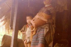 Thailand - Golden Triangle Trekking - Pipe smoking mother in Northern Thailand