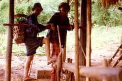 Thailand - Golden Triangle Trekking - Trekking porter and local farmer preparing rice in Northern Thailand