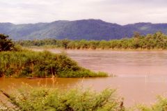 Thailand - Golden Triangle. View of the Mekong River behind and Mae Sai River in the front from the Thai side of the border. Burma is the tongue of land sticking out from the left, Laos is in the back.