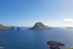 Denmark - Faroe Islands - View from Bøur. From left to right. The western tip of Vágar, the rocks of Drangarnir, the peaky Tindholmur and the islet of Gáshólmur. Beyond: The Atlantic Ocean